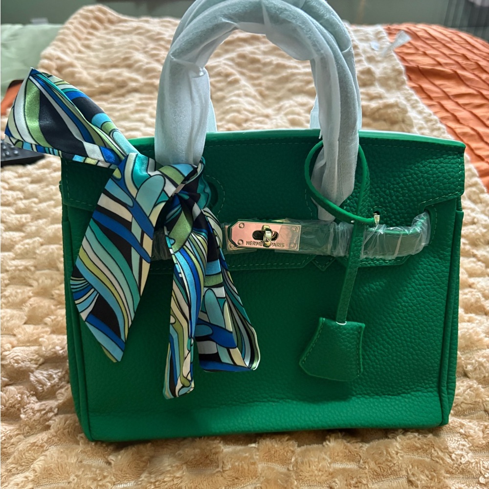 Green rolled leather top handle purse